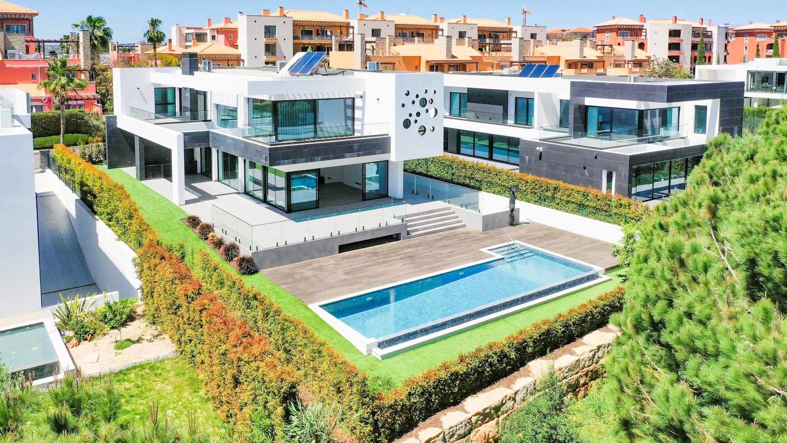 an aerial view of a house with a swimming pool